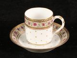 a cup and saucer on a saucer on a black background