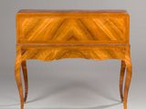 an antique wooden desk with a drawer on one side and a drawer on the other