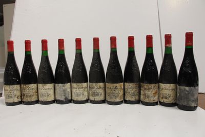 six bottles of wine are lined up in a row on a table