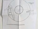 a piece of paper that has a drawing of a circular object on it