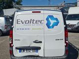 a white van that is parked in a parking lot