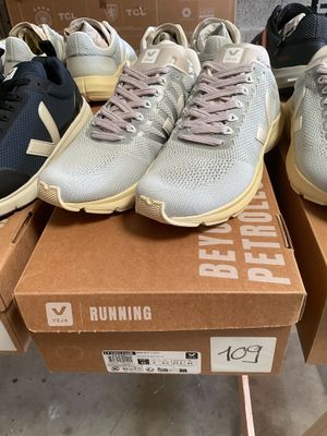 three pairs of new balance running shoes are on display in a box