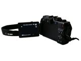 a camera with a strap attached to it ' s body