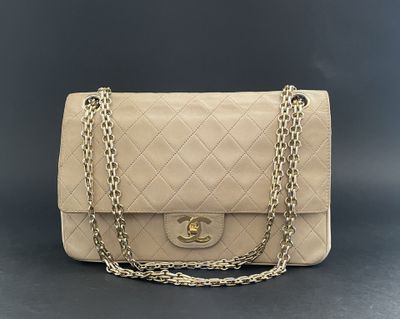 a chanel beige quilted leather shoulder bag with gold chain