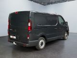 a black van that is parked in a room