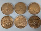 six bronze medals depicting the battle of waterloo and the battle of waterloo