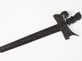 an old iron sword with a decorative design on it