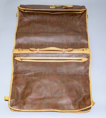 an old suitcase with a handle and two zippers on top of it