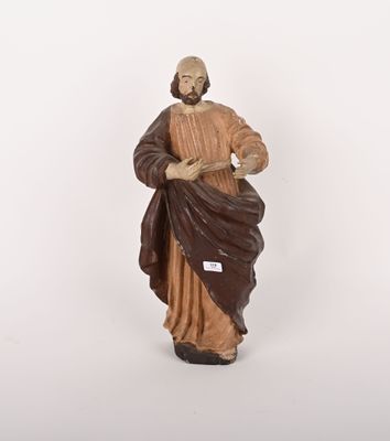 figurine représentant un homme vêtu d'une robe marron et coiffé d'un chapeau marron