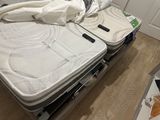 a bed that has a mattress on top of it