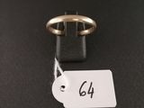 a close up of a gold ring with a price tag on it