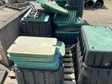 many containers sitting on a pallet in the yard