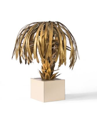 an image of a gold palm tree on a square base