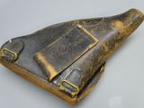 an old leather holster on a white table with a white background