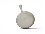 a white pan with a handle sitting on a white surface