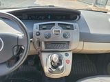 a dashboard of a car with a steering wheel and dashboard controls