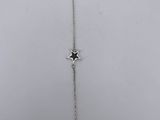 a silver bracelet with a star on the side of it