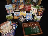many books and games in a box on a table