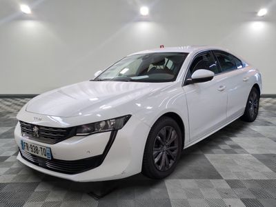 a picture of a white car parked in a garage