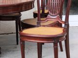 four chairs and a table in front of a door