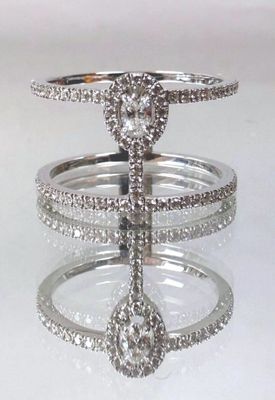a picture of a diamond ring on display on a table