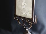 a picture of a woman in a picture frame on a stand