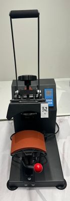 a machine that is sitting on a table with a bag