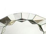 a mirror that is sitting on top of a table