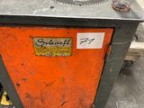a machine that is sitting on a table in a warehouse