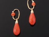 a pair of coral and gold earrings