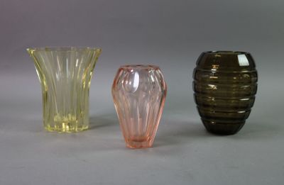three vases sitting next to each other on a table
