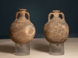 two vases that are sitting on a table