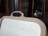a suitcase sitting on the floor in the living room