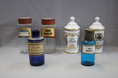 several bottles of medicine are lined up on a counter