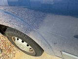 a close up of a car tire on the side of the road