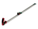 a green and red clamp on a white background