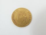 a gold coin with a picture of a woman on it