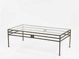 a glass coffee table with a metal frame and metal legs