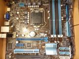 a motherboard in a cardboard box that is open
