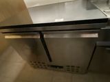 a stainless steel counter top with a sink and a dishwasher