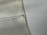 a close up of a piece of fabric with a hole in the middle of it