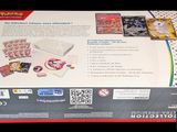 the box is open on a black background with a picture of the contents