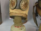 many different types of gas masks on a table