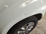 a close up of a car tire on the ground