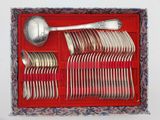 a red tray with silverware and spoons in it