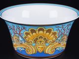 a bowl with a design on it sitting on a table