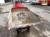 a dump truck that is sitting in the dirt