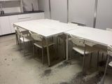 a room with a table and chairs in it