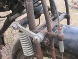 a close up of an old motorcycle with a rusted tire
