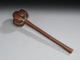 a close up of a wooden baseball bat on a white surface